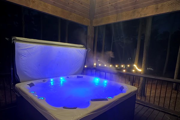 Unwind in the private hot tub, surrounded by the quiet beauty of the forest.