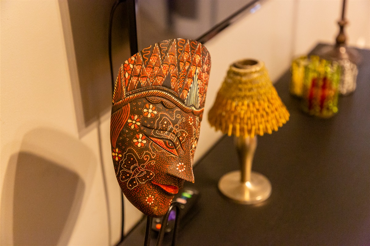 Unique African-inspired décor adds warmth and character to the room’s design.