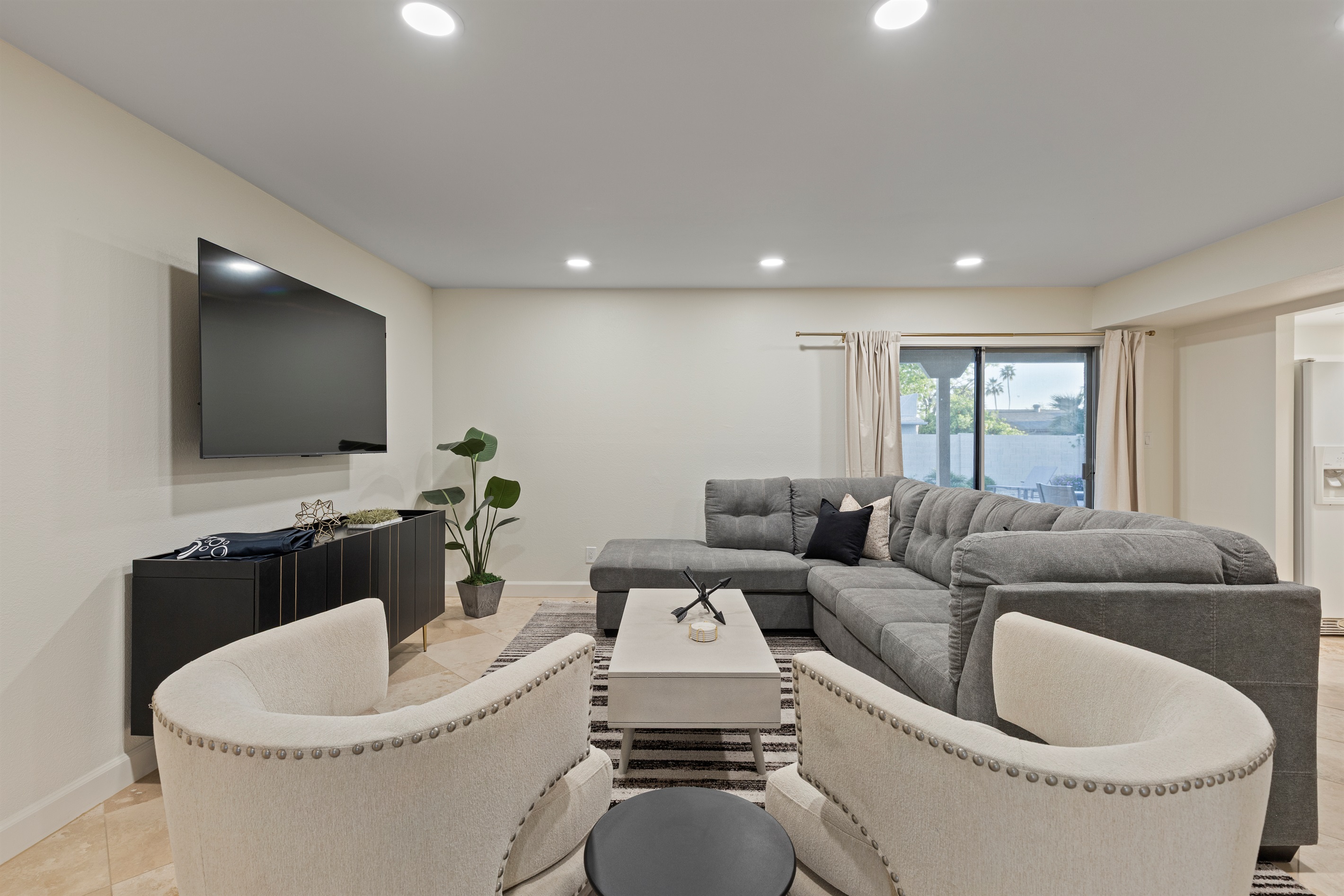 Comfortable living room with large TV—perfect for movie nights