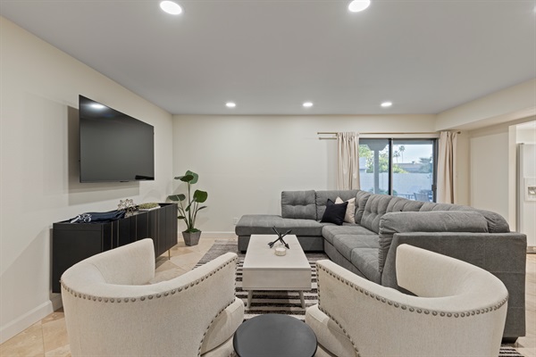 Comfortable living room with large TV—perfect for movie nights