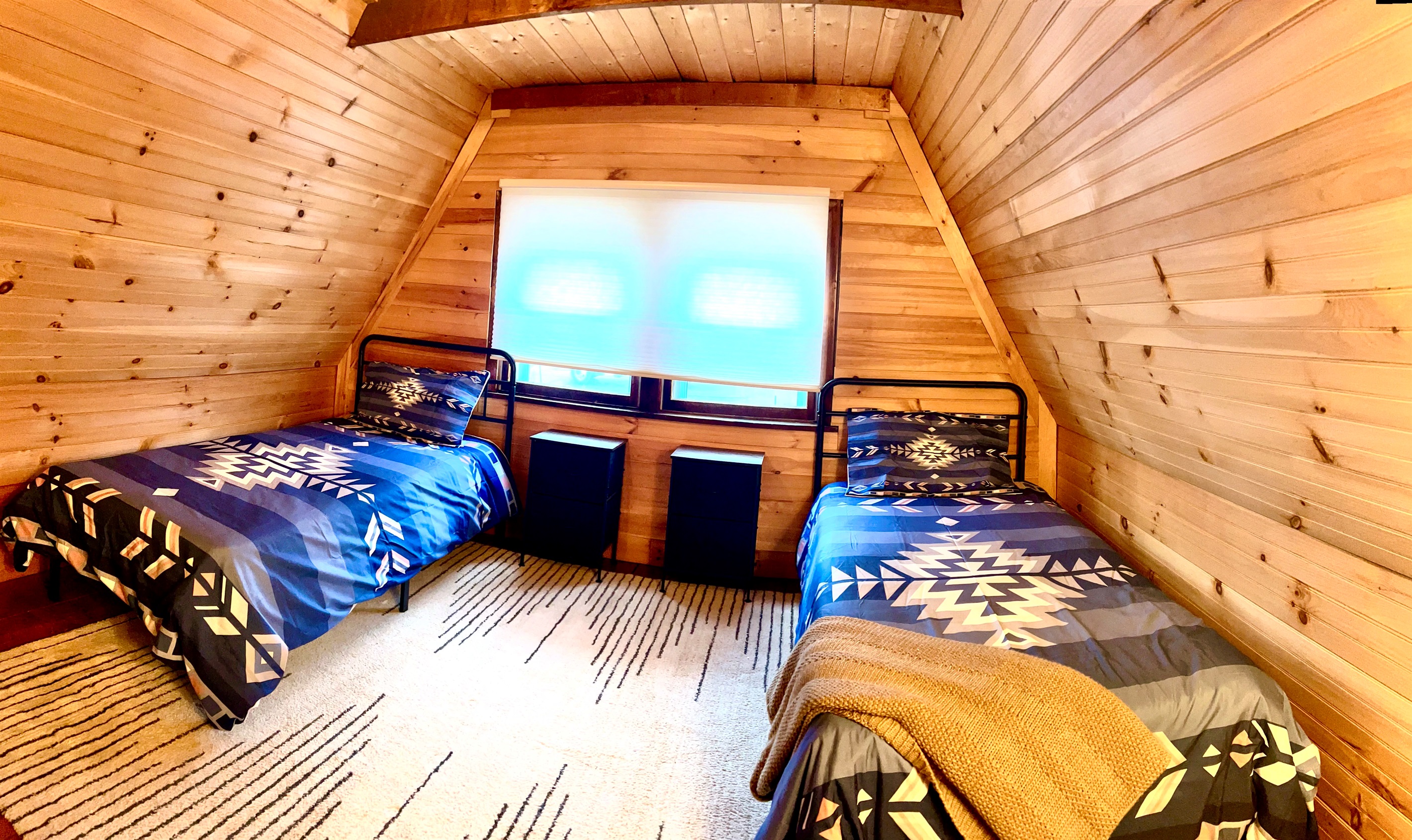 First loft bedroom with two twins, please note there is an open doorway separating the two loft bedrooms.