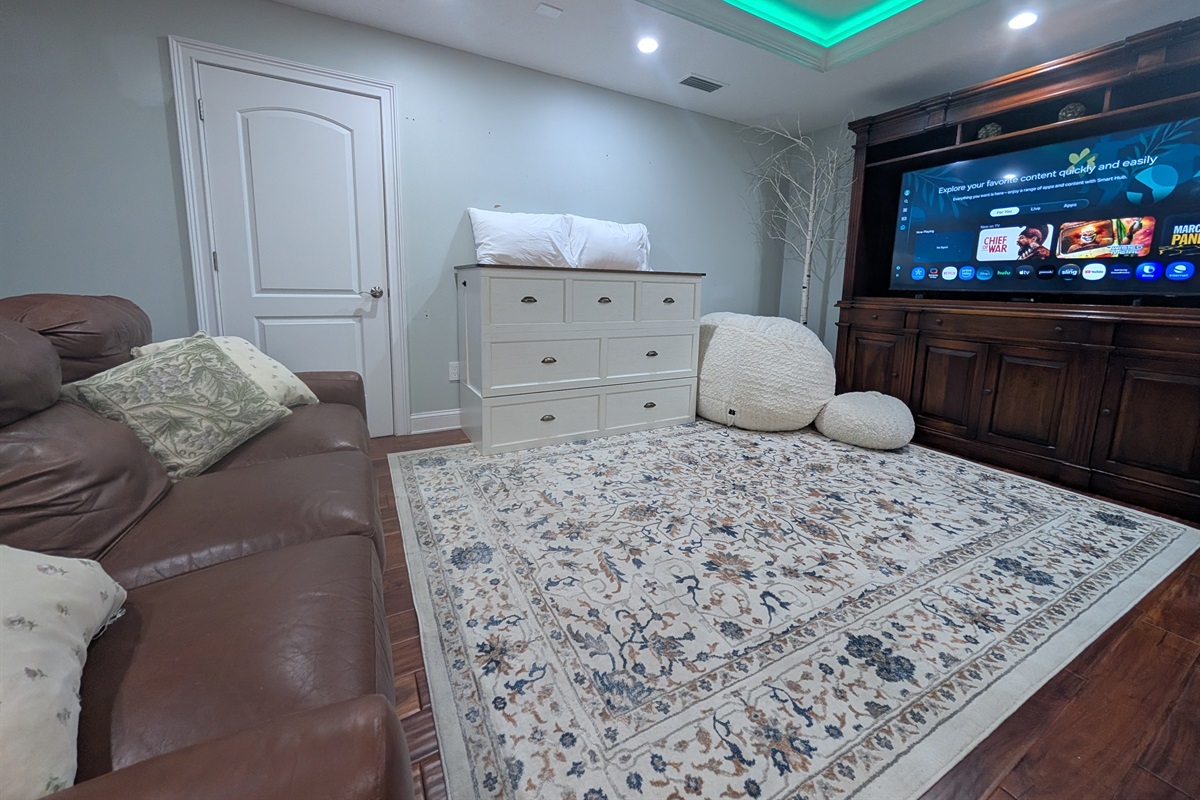 Full upstairs lounge with a pull out murphy bed