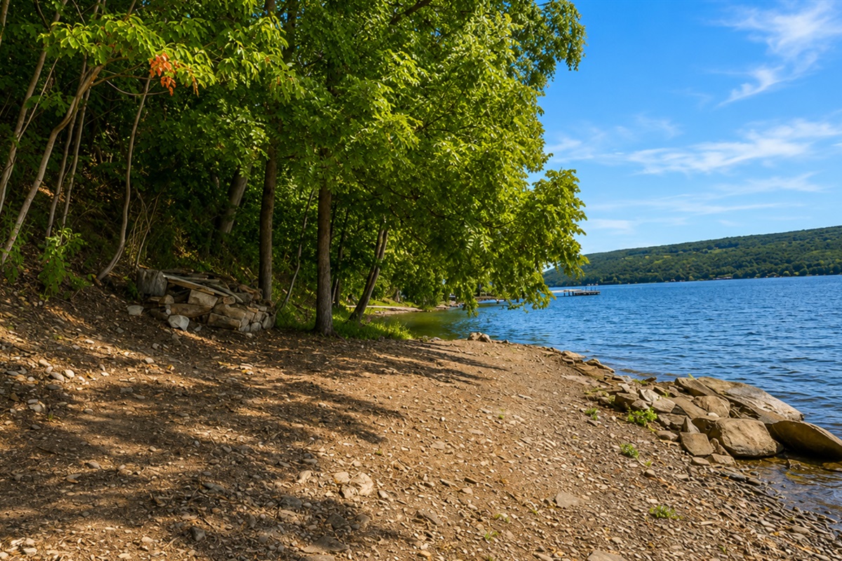 Enjoy peaceful lakefront views along the shaded shoreline, ideal for walks and waterfront relaxation.