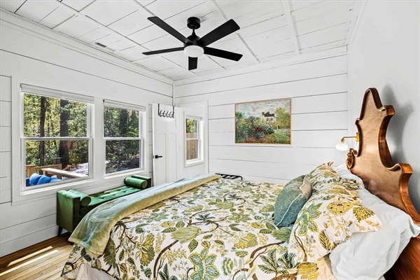 Primary bedroom with king bed with access to a luxurious en suite bath.