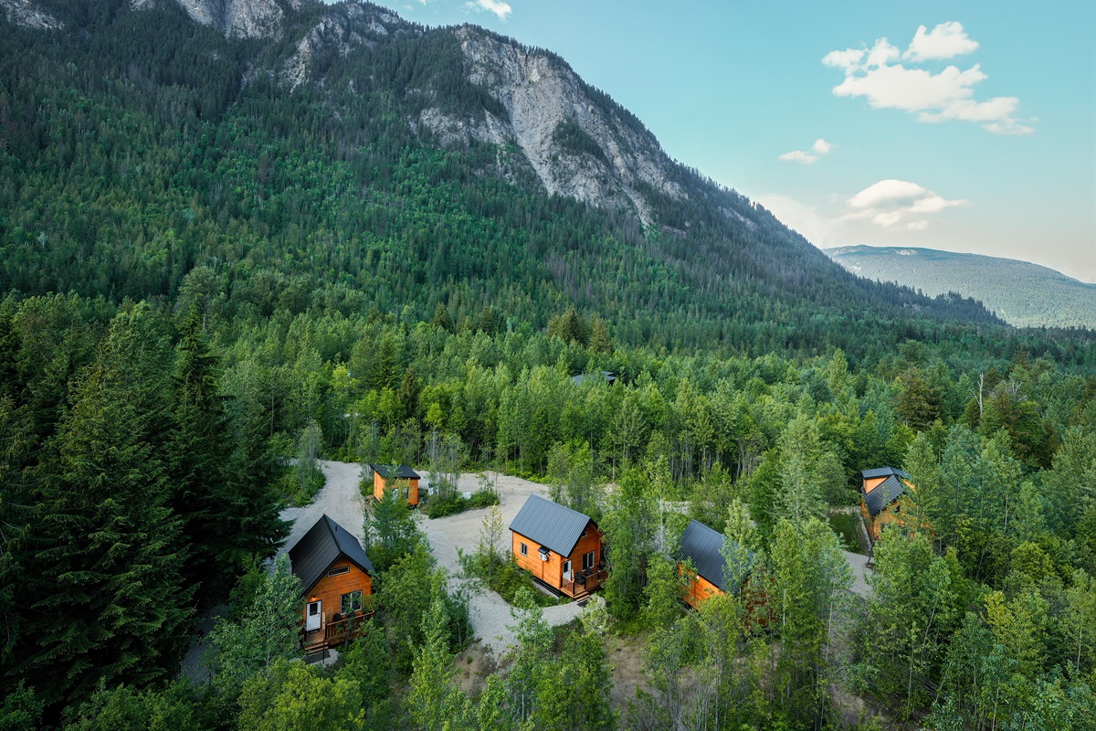 Alpha Mountain Lodging in the summer with Boulder Mountain in the backdrop - Grey Lodge is second from the bottom left.