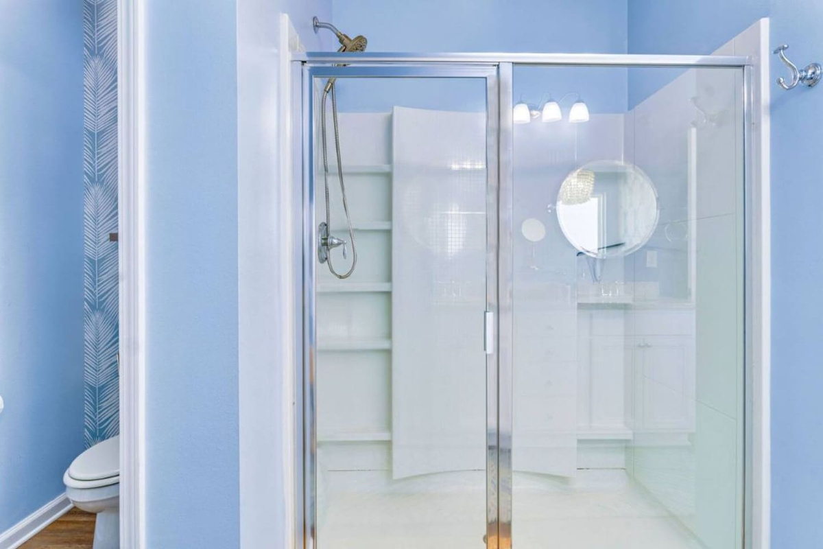 Spacious walk-in glass shower with modern finishes for a refreshing spa-like experience