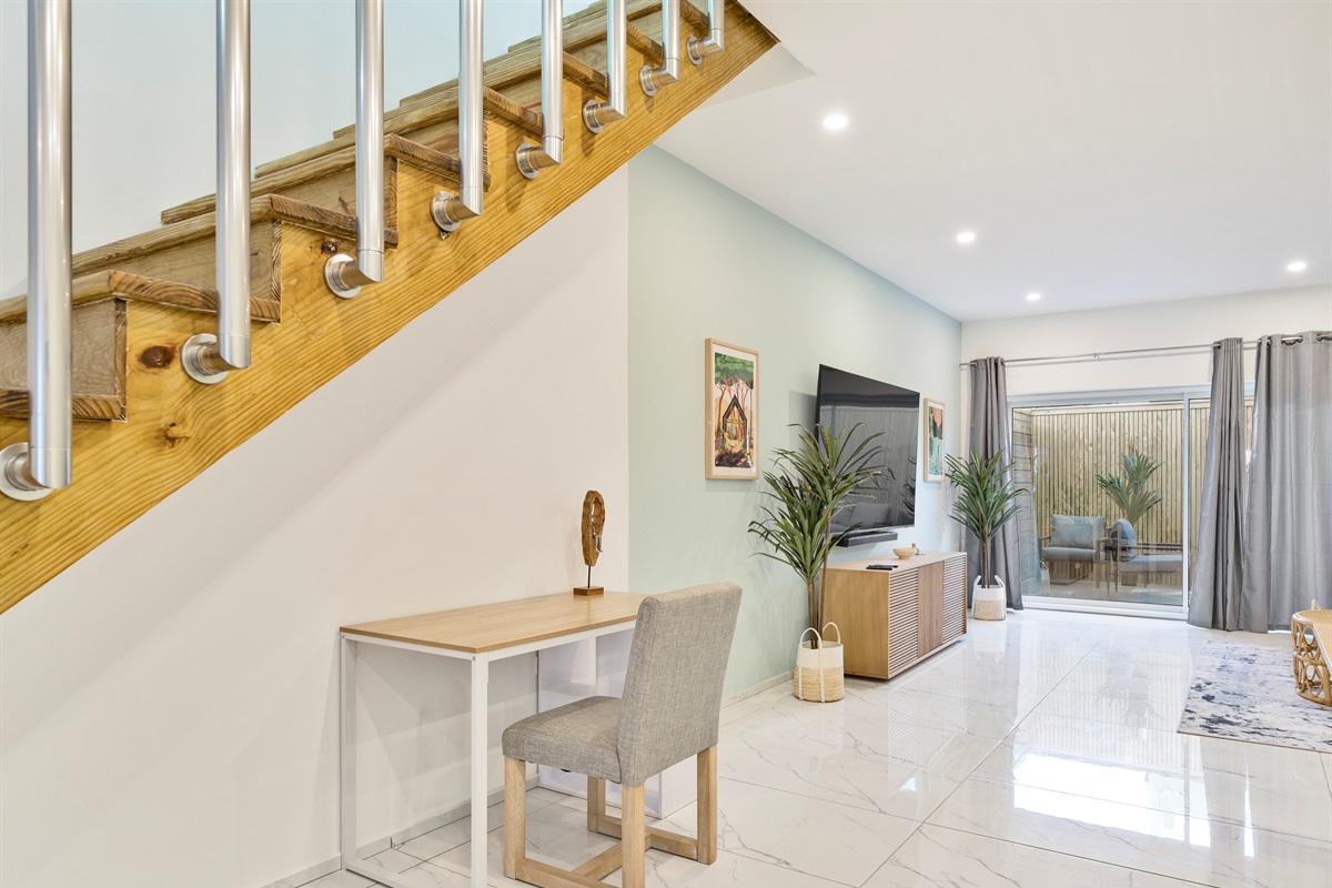 Workspace under the stairs to handle any last minute work before relaxing