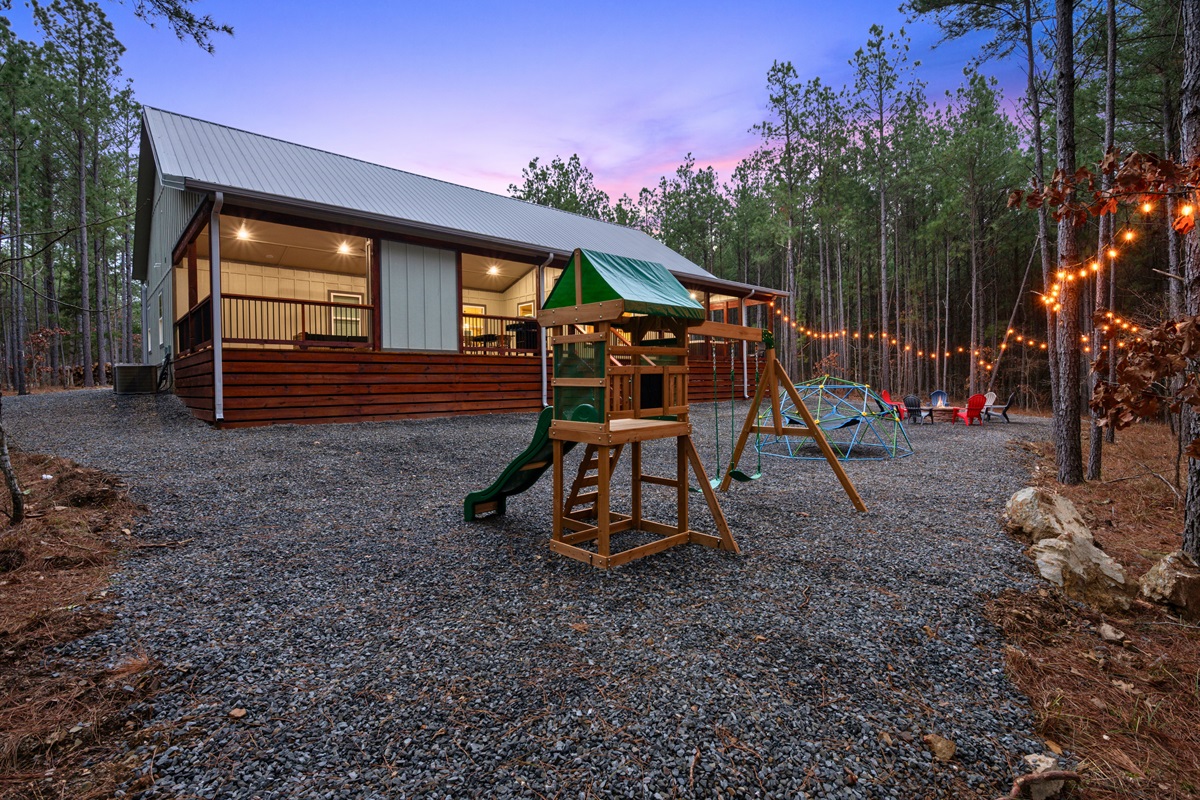 The backyard playset gives younger guests their own place to climb, slide, and burn off energy while enjoying the fresh air.