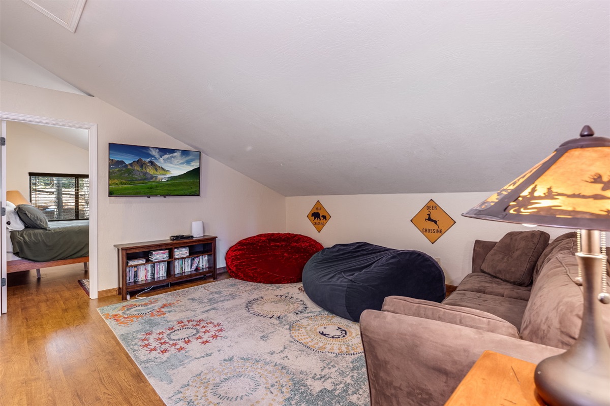 Cozy loft located on 3rd floor. Large bean bags, sofa, SMART TV and DVD player. 