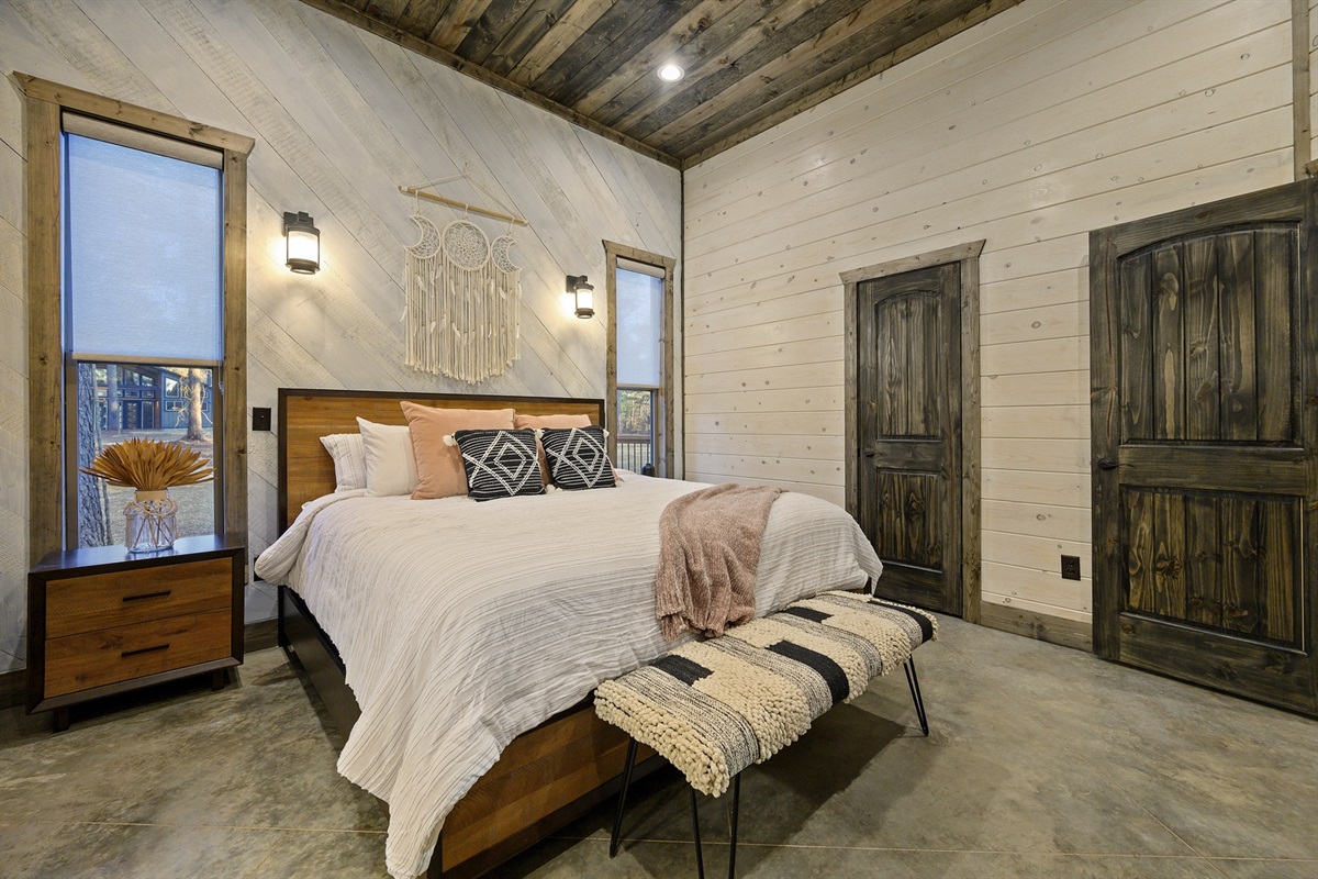 Soft bedding, warm wood accents, and gentle light set the tone for deep rest. Wake to calm forest views and a slow, unhurried morning.