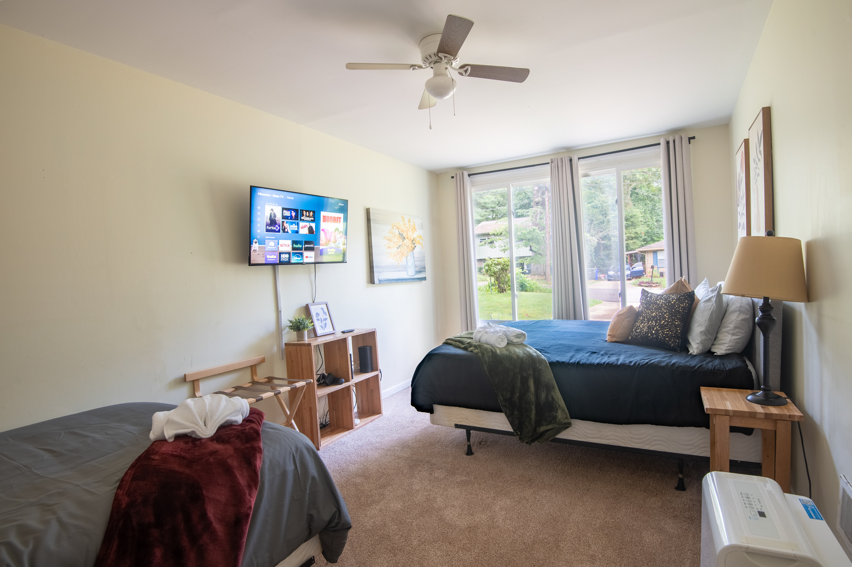 Traveling with family or friends? This spacious bedroom offers both a king bed and a full bed, giving everyone plenty of room to spread out, relax, and recharge after the day's adventures.