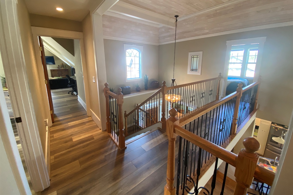 Taken from the kids playroom, a king bedroom is to your right, the large bonus room straight ahead and to your left down the sky bridge is the Queen bedroom. 