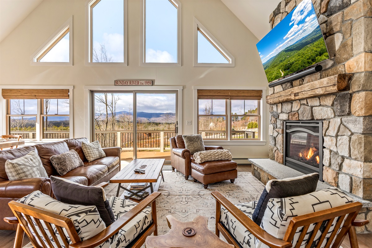 Relax on the open-concept main floor and enjoy mountain views, a fireplace, and a big-screen TV.