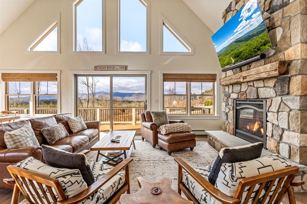 Relax on the open-concept main floor and enjoy mountain views, a fireplace, and a big-screen TV.