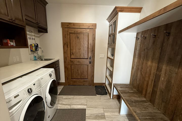 laundry detergent, dryer sheets, iron and ironing board provided 