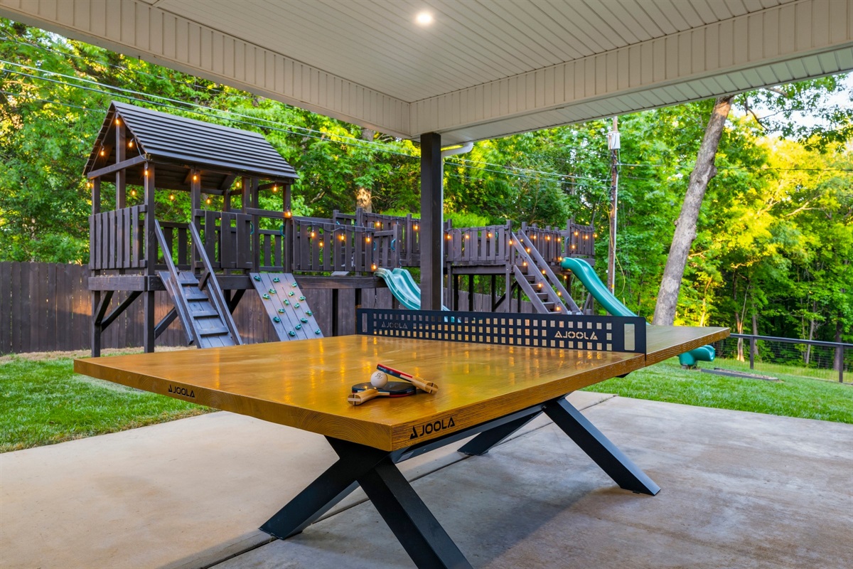 Covered Ping Pong Patio AND a custom designed and built Lookout Fort will keep the young and young at heart engaged for days!