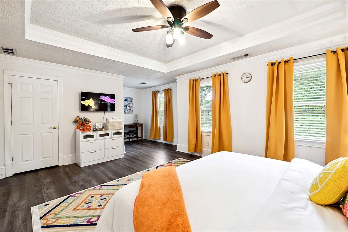 Bedroom 3 is located upstairs, a master bedroom featuring a king bed, TV, a private en-suite bathroom, and a dedicated desk space.