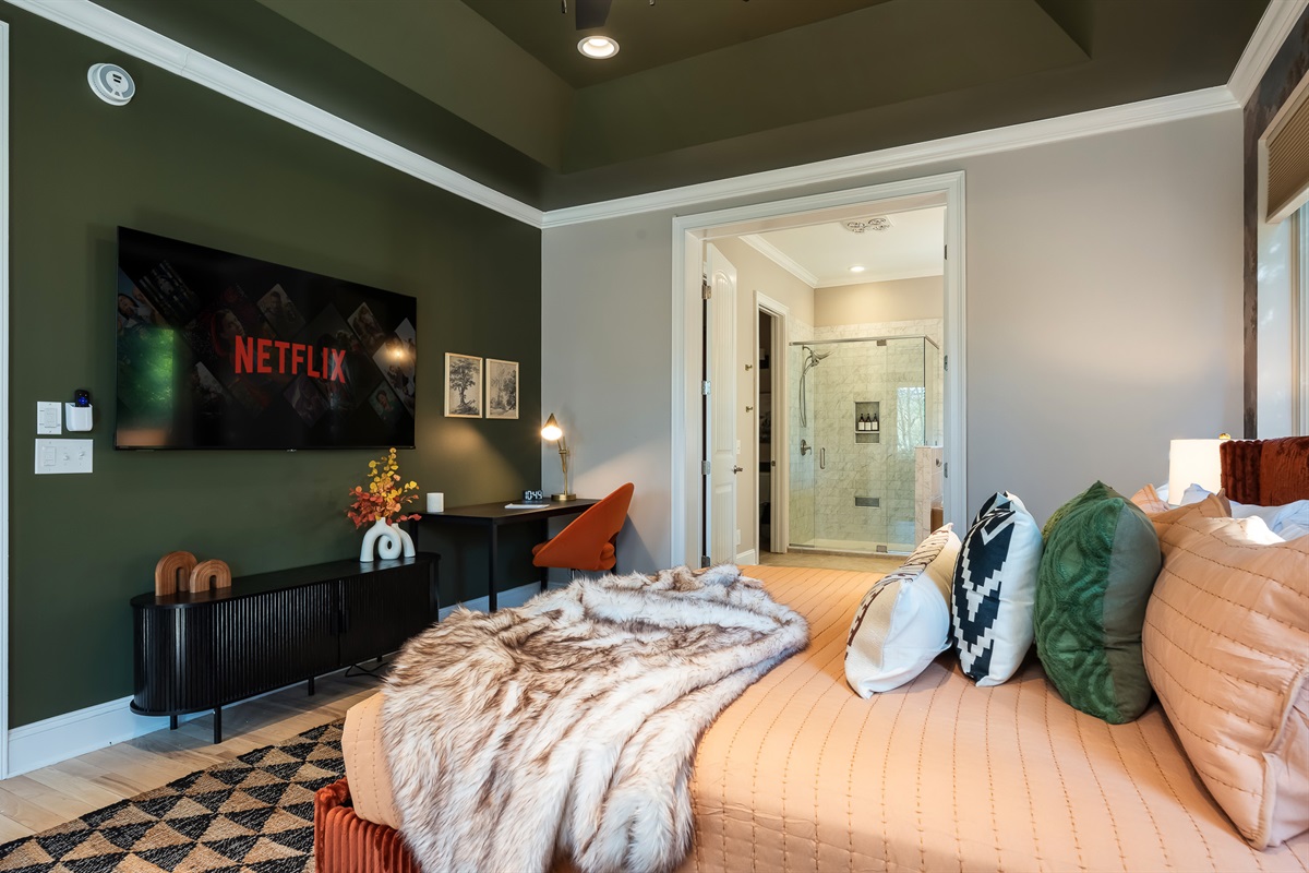 Bedroom with layered textures and warm tones - designed to feel both comfortable and refined