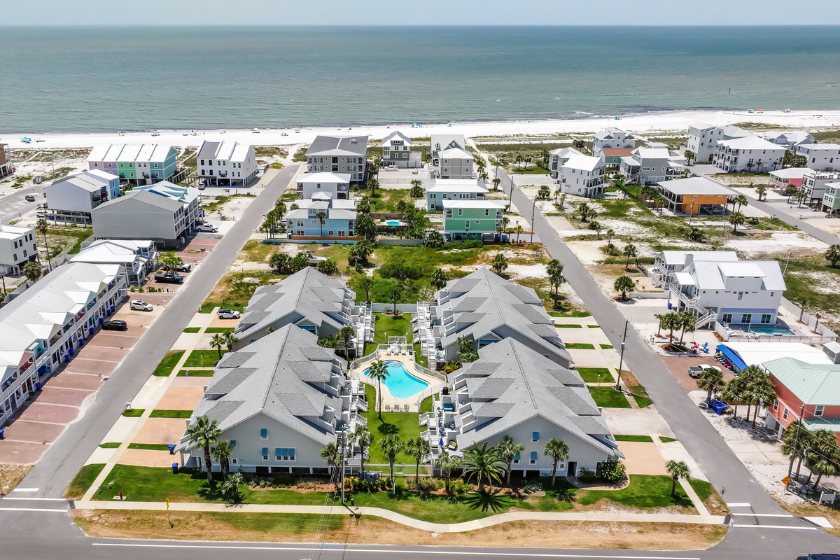 Aerial view showcasing our unbeatable location just a short walk from the beach and community pool
