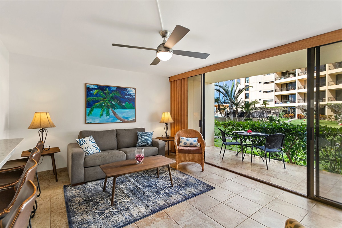 The living room also features a full-size pull-out sofa and direct access to the lawn in the courtyard.
