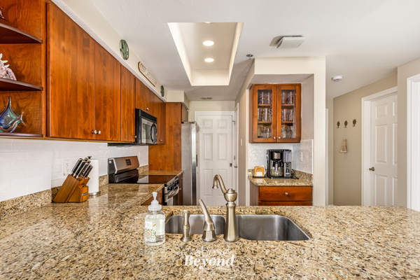 Full kitchen with granite countertops, stainless appliances, and plenty of space for meal preparation for the whole family