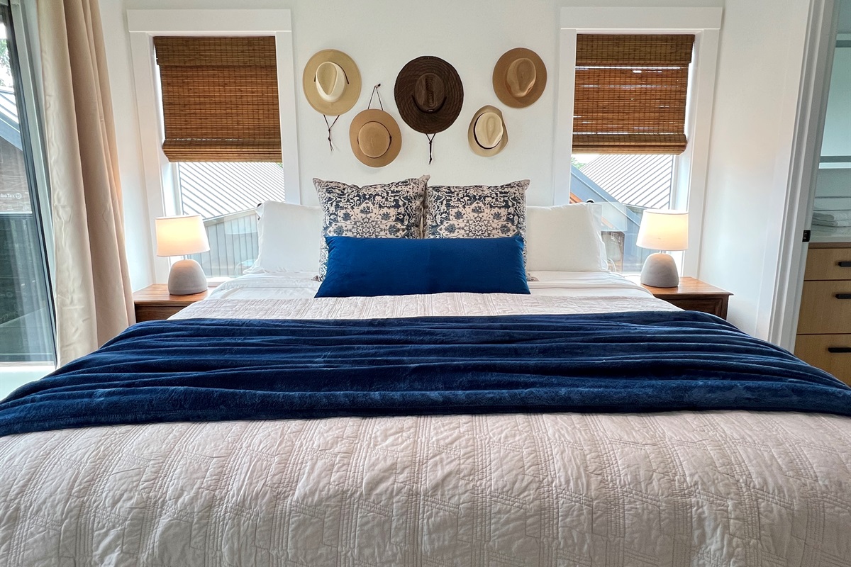 31 Villa B primary king suite — walkout deck, private en-suite bathroom, and in-room coffee.