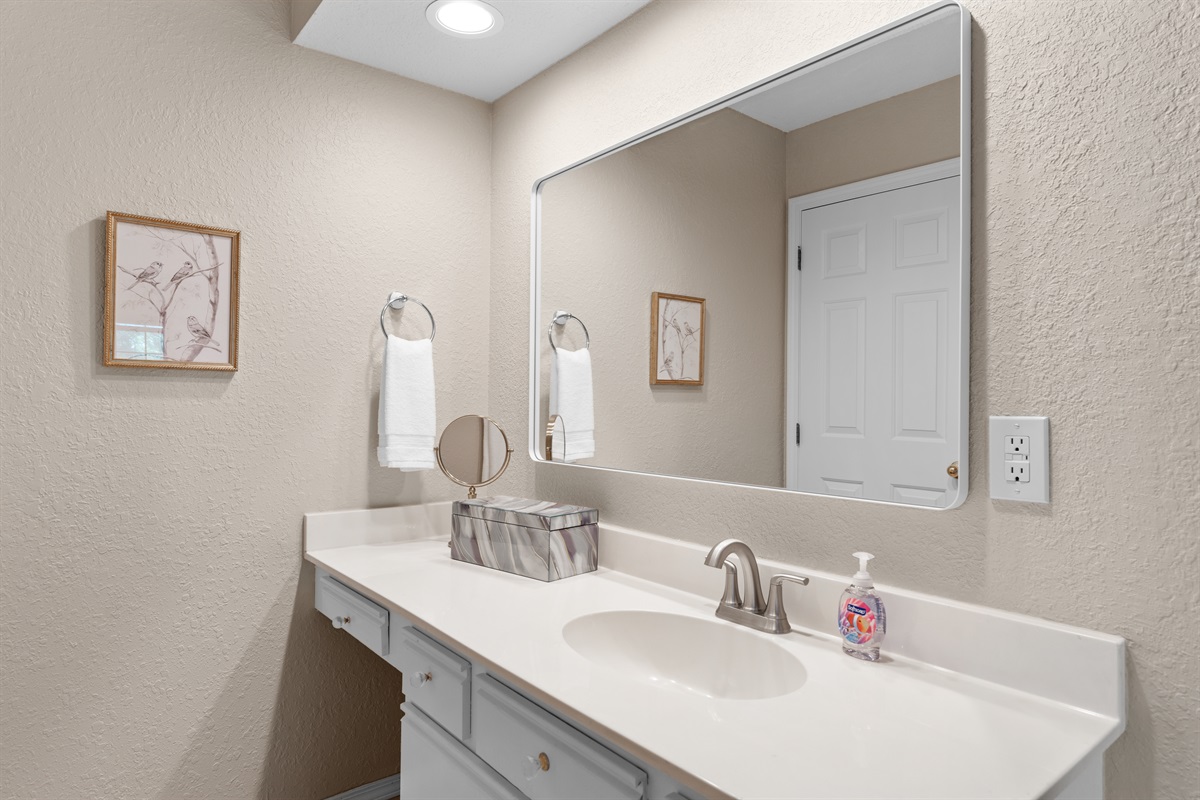 🧼 A closer look at the primary suite’s vanity—modern lighting, plenty of counter space, and clean design for a polished, functional feel.