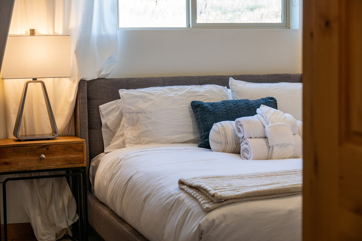 Cozy bedside touches make this bedroom feel welcoming from check-in to checkout.