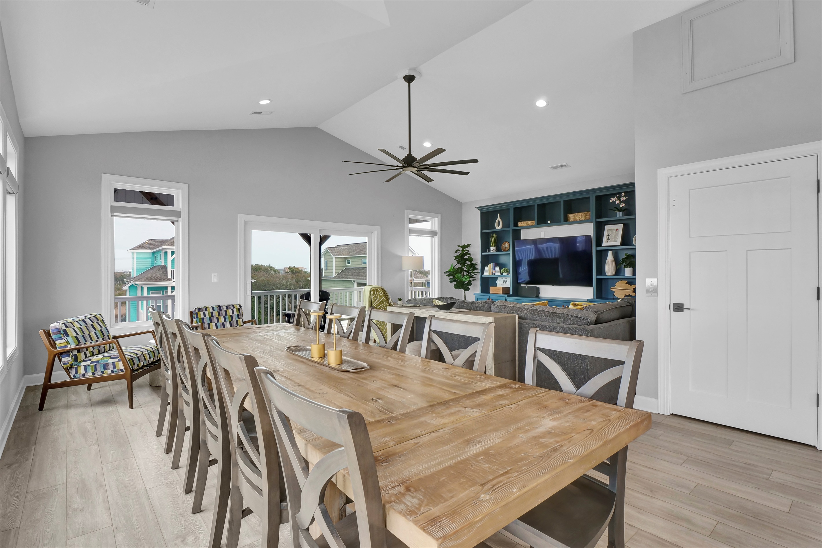 Gather around the dining table where every meal becomes a memory—share laughter, toast to vacation, and savor the joy of being together in this bright, inviting space.