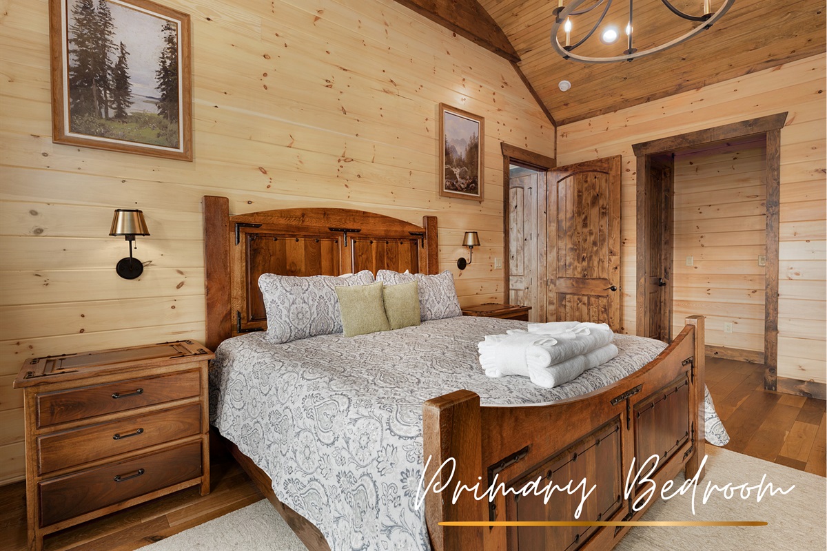 Drift off to sleep in this upstairs master bedroom, complete with a king bed and serene mountain views.