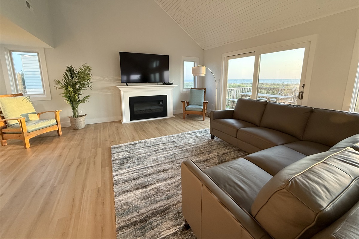 Relax in the living room on the comfortable leather couch and chairs.