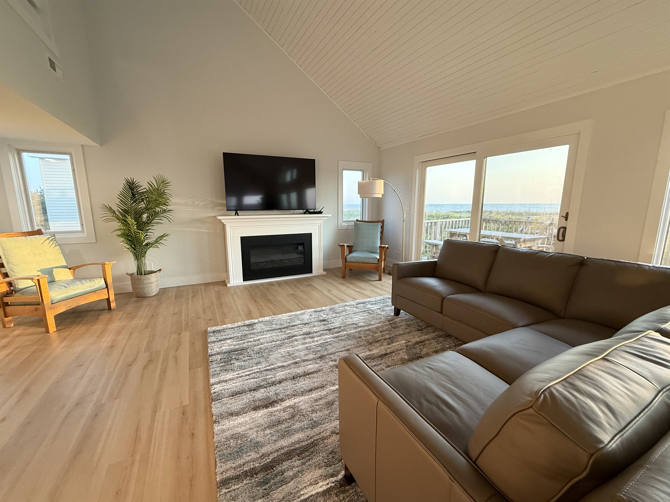 Relax in the living room on the comfortable leather couch and chairs.