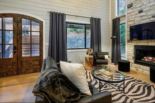 Cozy living space with fireplace and stylish seating for relaxing evenings.