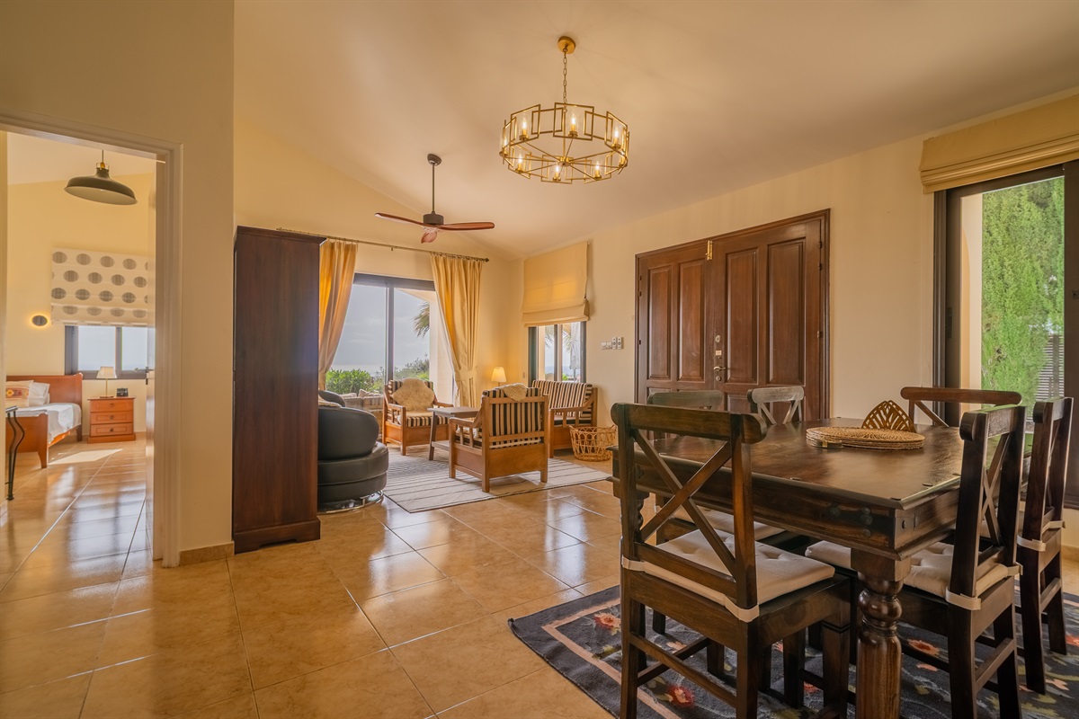 Open, airy, and social layout of main room with high ceilings.