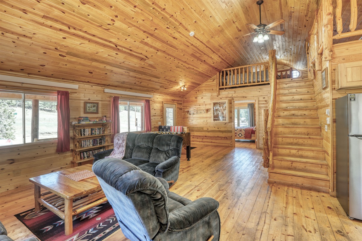 Living area with stairs up to loft