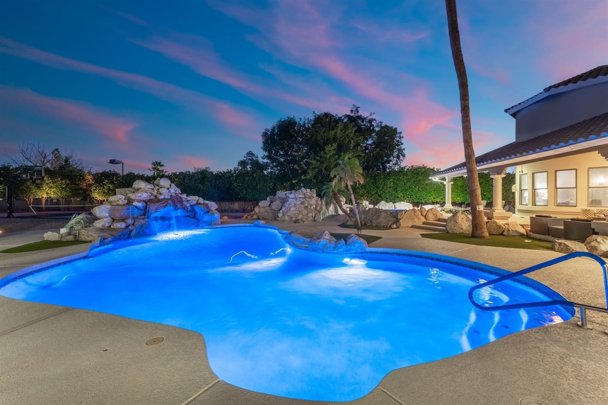 Enjoy tranquil evenings as the cascading waterfall enhances this uniquely shaped, family-friendly pool.

