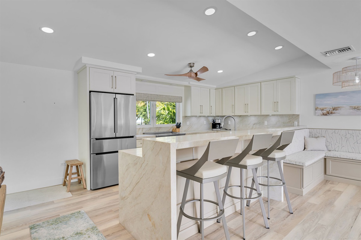 Kitchen with barstools and banquette.