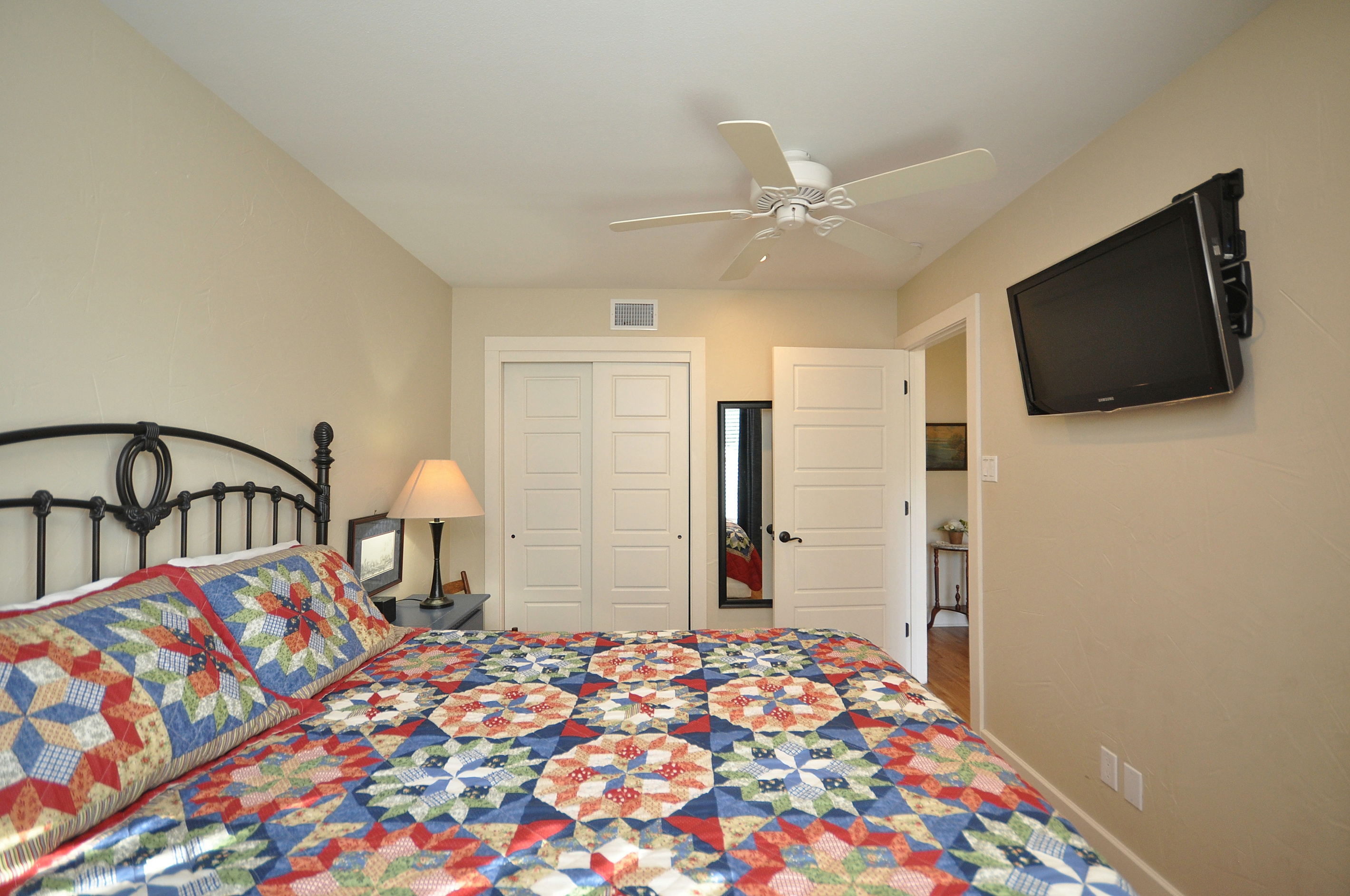 Secondary bedroom with flat screen TV.