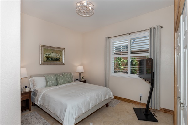Bright and relaxing bedroom with queen bed and natural light