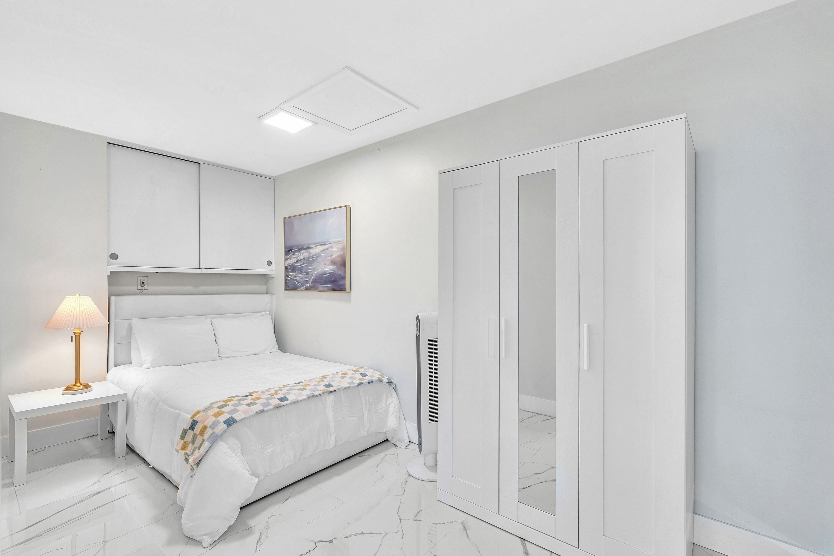 Bright, comfortable double bedroom with generous wardrobe storage.