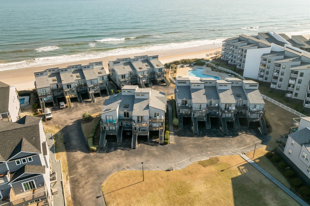 Drone view highlighting the beachfront location and private balconies facing the Atlantic Ocean
