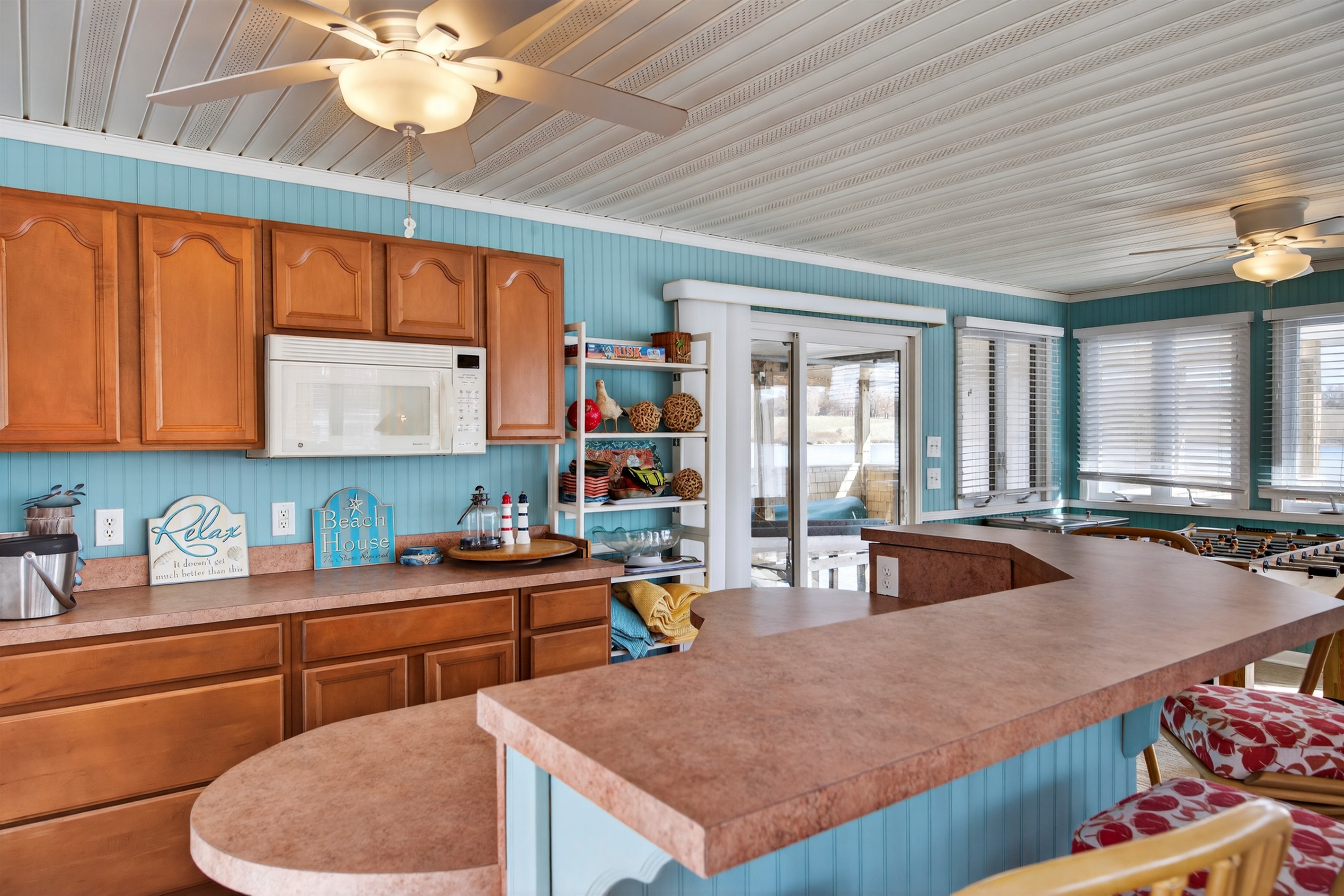 This boathouse features a convenient kitchenette and wraparound counter for effortless lakeside hosting.