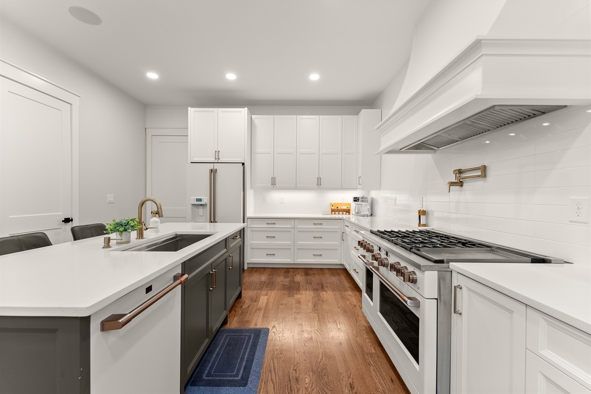 Chef’s kitchen with Café appliances and room for everyone to gather.