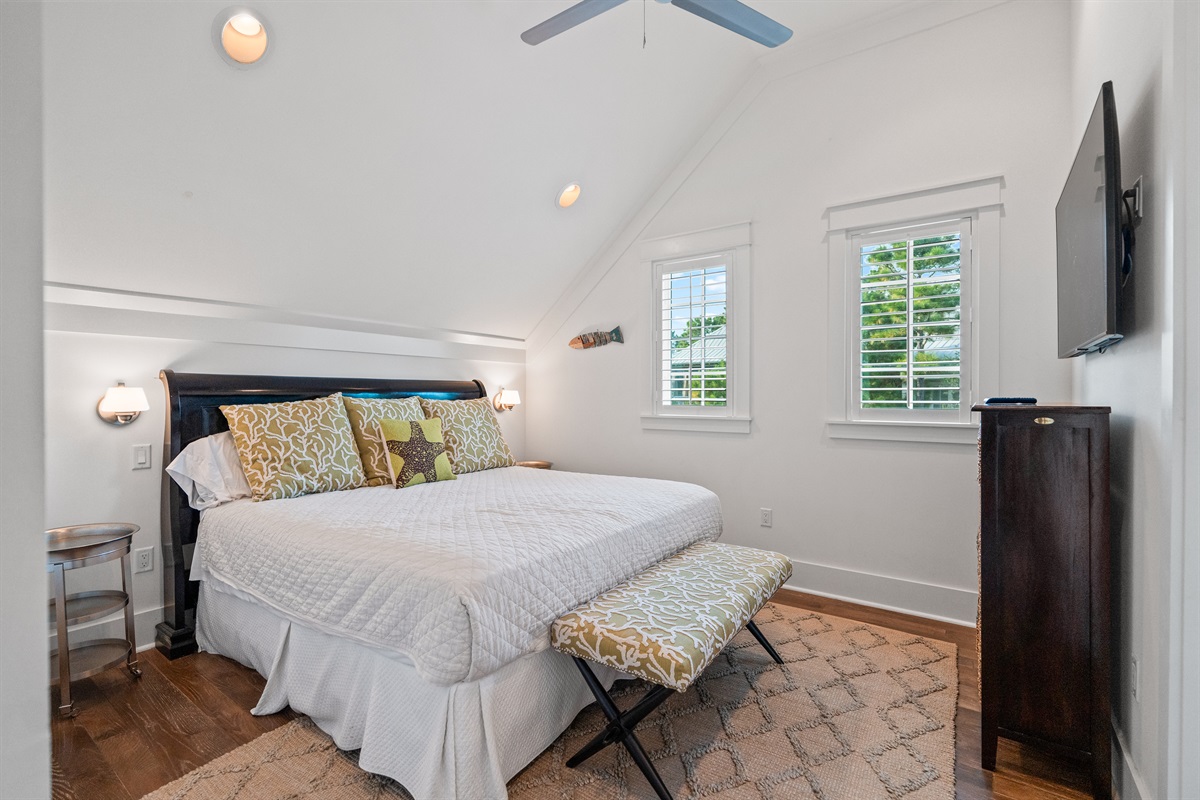 Upstairs king suite with ensuite bathroom, closet and TV. 