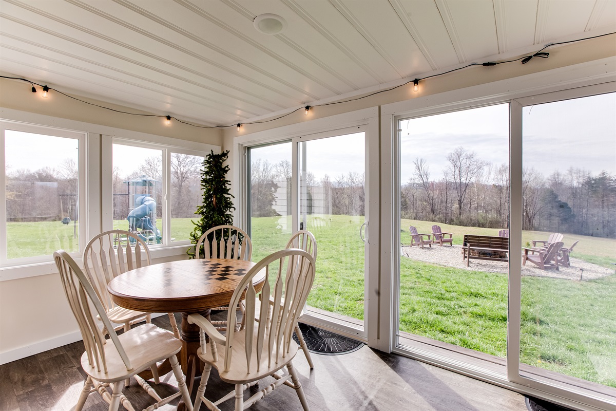 The fire pit and playground are located just outside the sunroom.