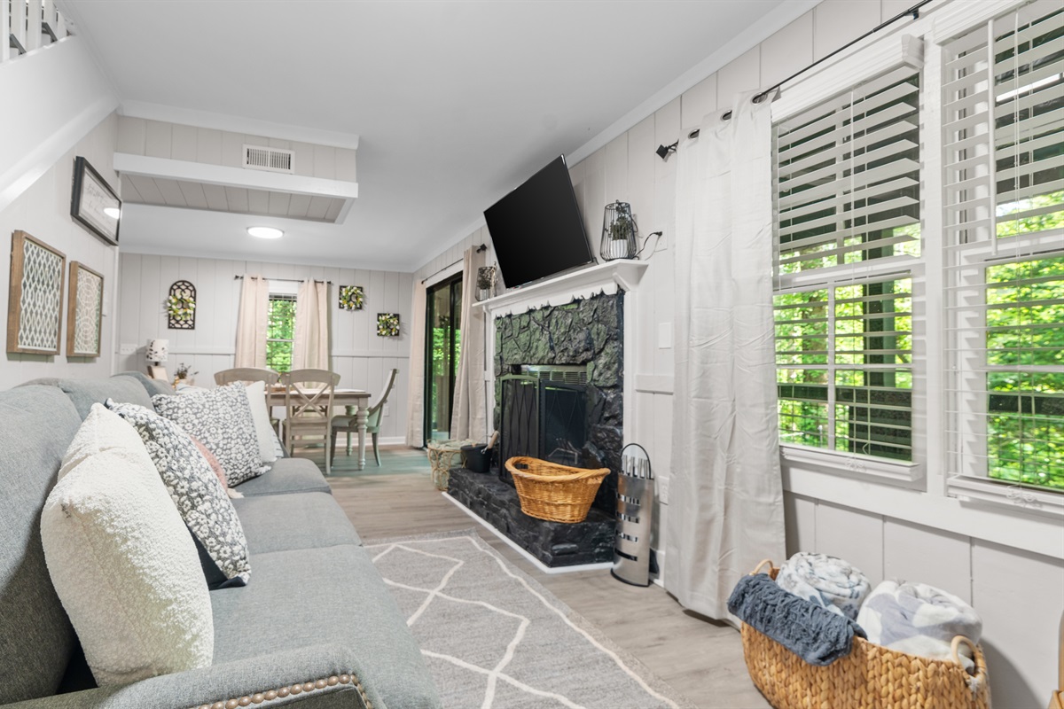 Living room w/ access to the back deck