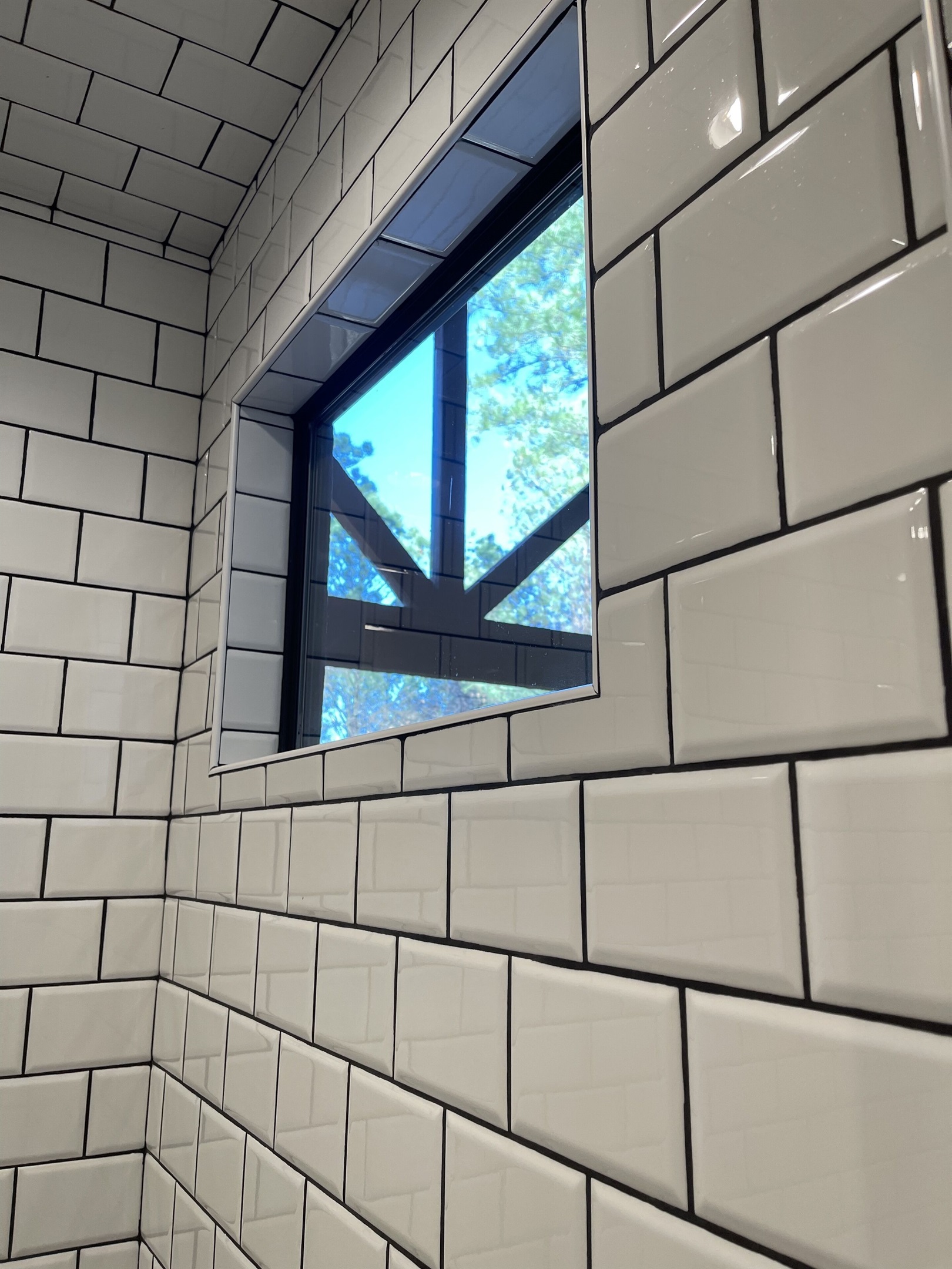 The entry of the large subway tiled shower.