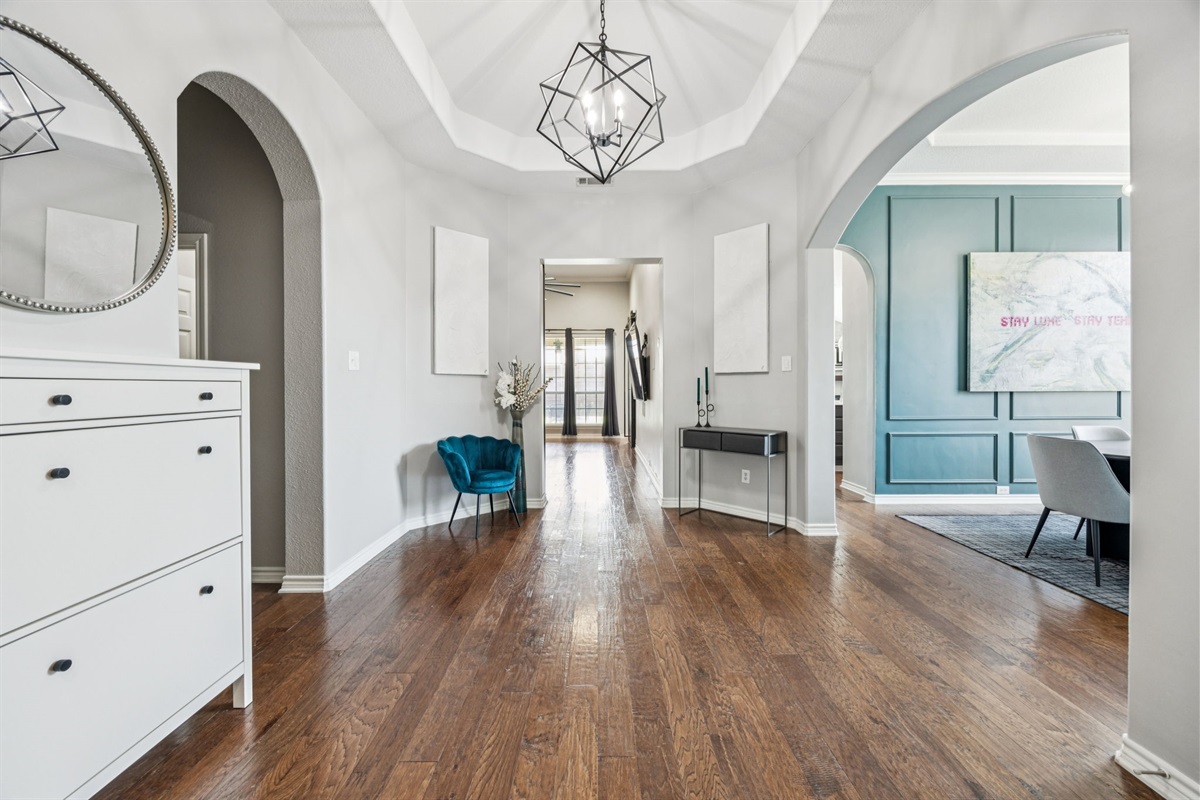 Welcoming foyer with open sightlines into the heart of the home.