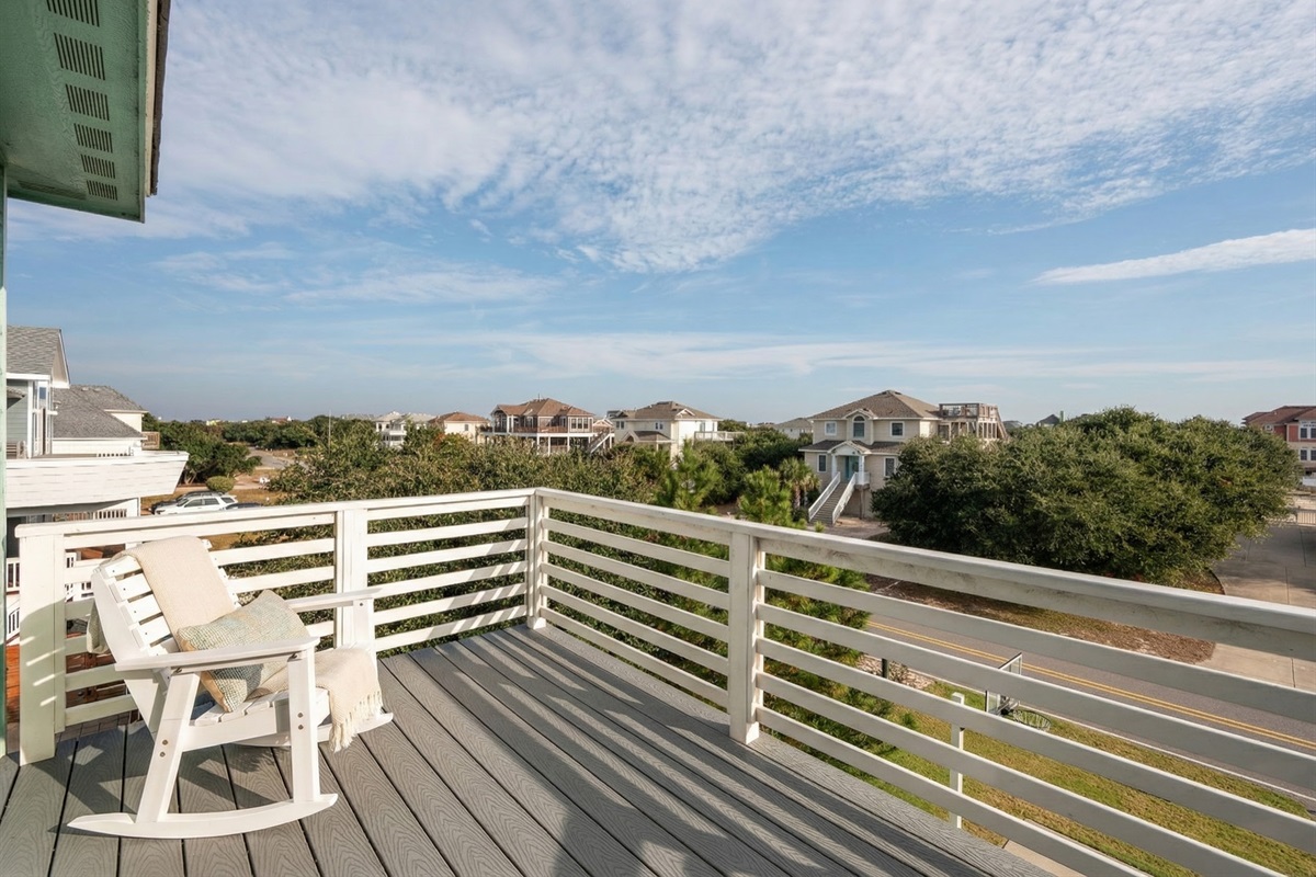 Relax on the private balcony with stunning Outer Banks views.
