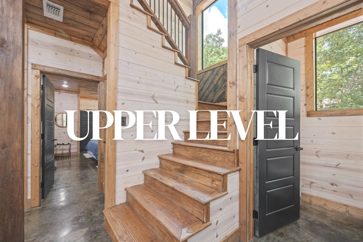 Stairway to the upper level with more bedrooms and living space.
